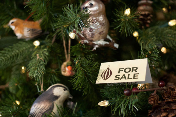 for sale sign on a christmas tree with ornaments