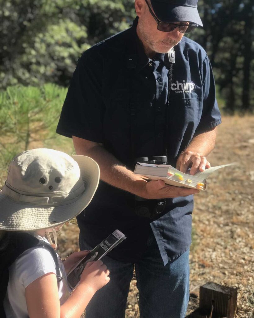 Chirp's owner, Randy Putz, helping a young birder ID a bird on a Chirp Bird Walk.