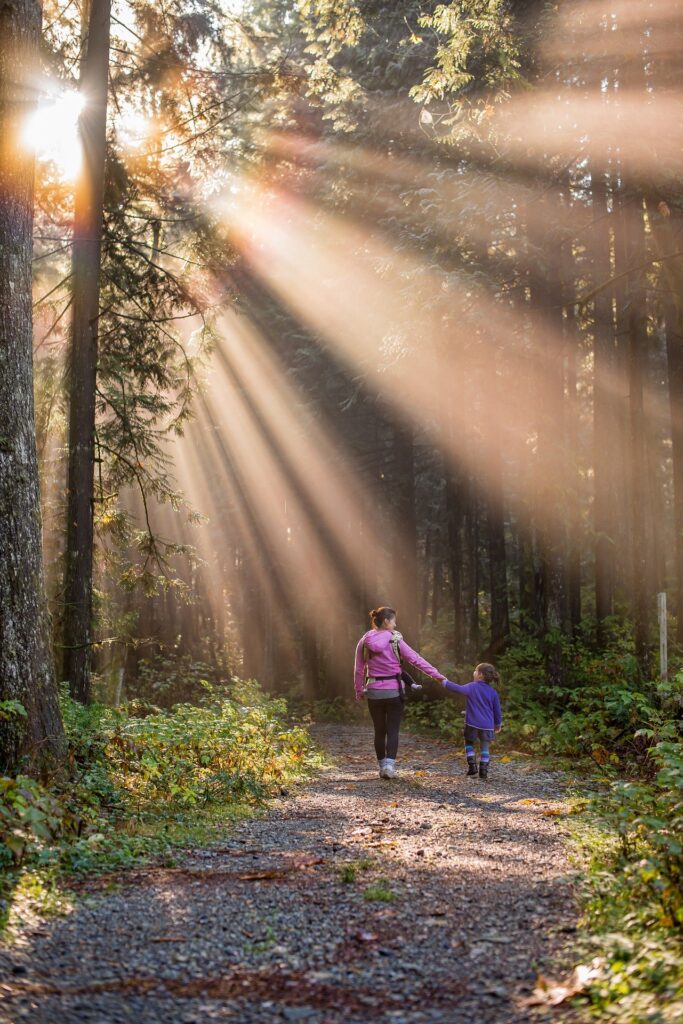 A mother and daughter go on a nature hike.