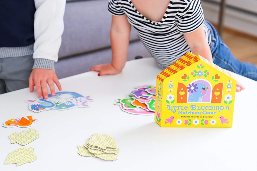 A little girl and boy play Little Bluebird's Matching Game, available at the Chirp store.